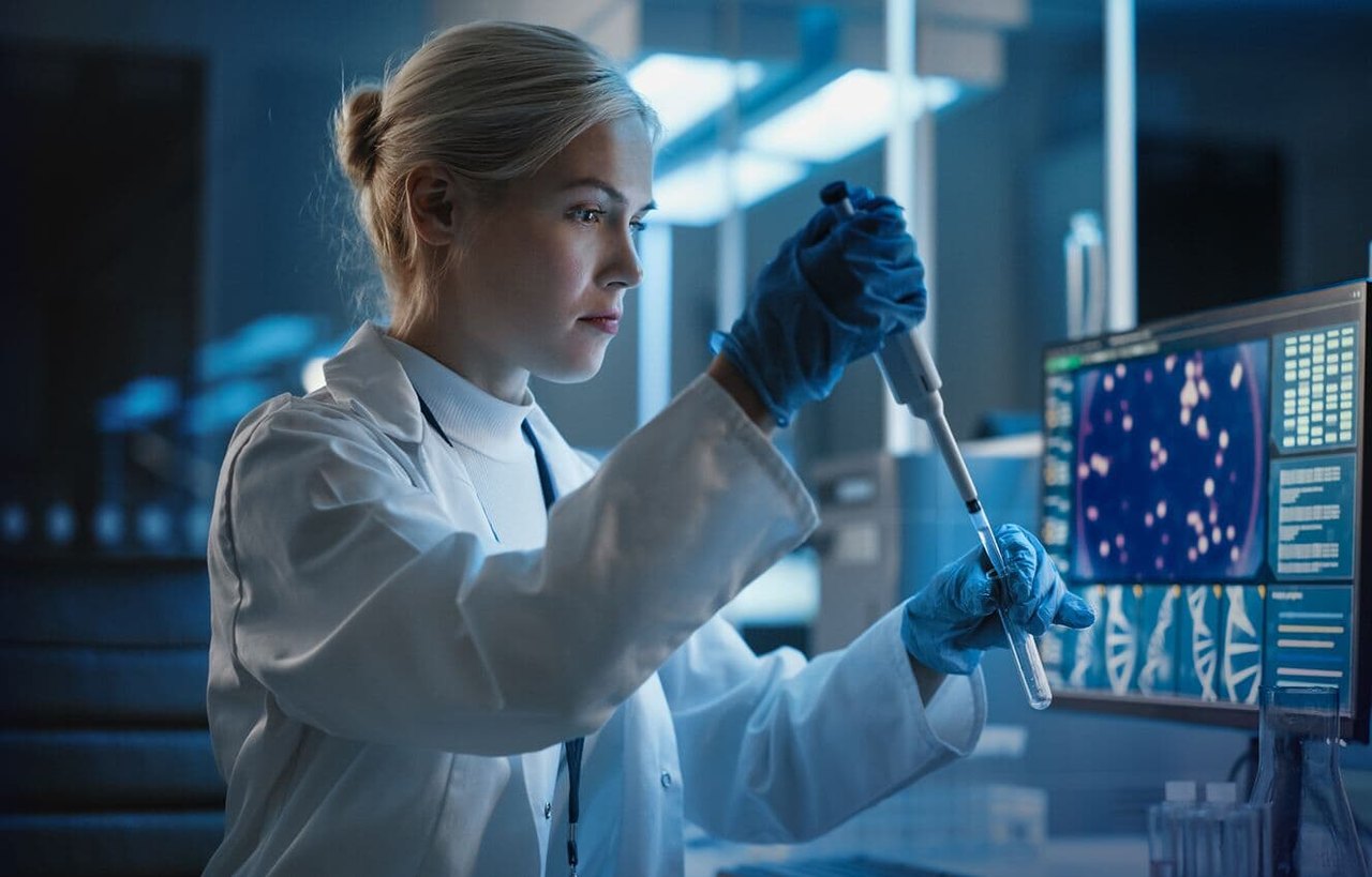 Scientist pipetting a sample in a lab